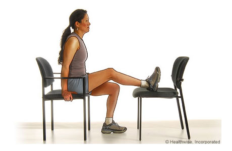 A woman doing the knee extension exercise